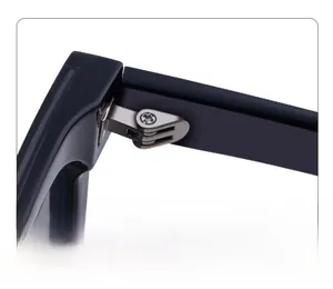 Detailed macro view of the sturdy metal spring hinge and screw of these sunglasses