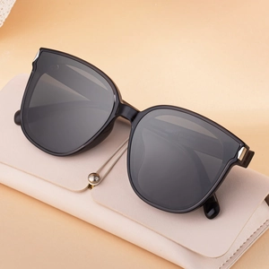 2025 Trendy oversized square polarized sunglasses with grey nylon lenses on a beige leather case