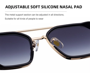 Close-up of adjustable soft silicone nose pads on gold metal sunglasses frame