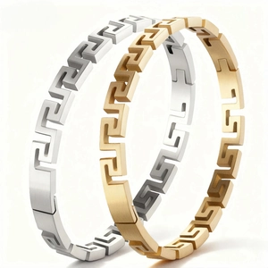 Bracelets en acier titane avec motif grec en finitions dorée et argentée pour femme