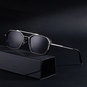 Retro square punk sunglasses with metallic frame and textured case on dark background