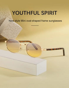 Mini oval gold metal sunglasses with yellow gradient lenses and tortoise temples