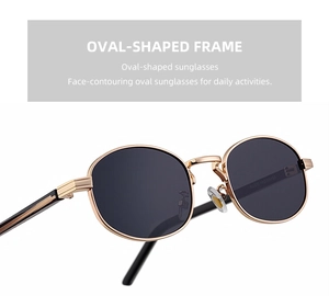 Detailed close-up of oval metal sunglasses showing the fine texture on the gold frame