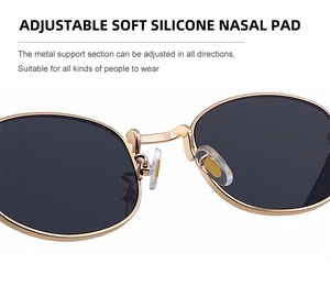 Detail of adjustable soft silicone nasal pads on oval metal frame sunglasses