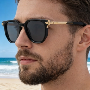 Detail of male model wearing polygon sunglasses with zinc alloy hinge on sunny beach