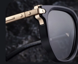 Detailed close-up of zinc alloy temples and decorative flower rivets on sunglasses