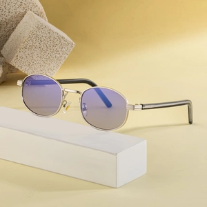 Retro oval metal sunglasses with gradient lenses displayed on a minimalist yellow background