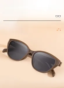 Detail of wide square sunglasses with TR framework and dark grey lenses for women