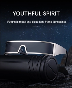 Futuristic silver metal square sunglasses with one-piece smoke lens on black rock textures