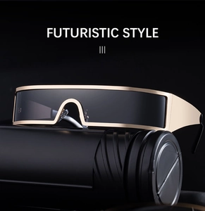 Close-up of futuristic gold metal frame and dark grey unibody lens of the sunglasses