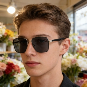 Detail of square polarized sunglasses with silver metal frame and textured temples on model