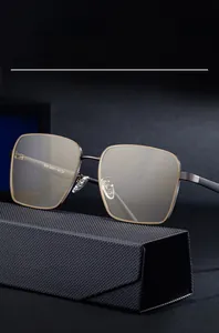 Detailed macro view of square nylon sunglasses with metal trim and a textured storage case