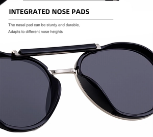 Close-up of integrated nose pads on black metal frame retro punk oval sunglasses
