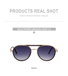 Detailed front view of gold metal double bridge sunglasses with gradient gray lenses