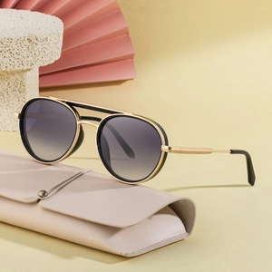 Vintage oval metal double-bridge sunglasses in black and gold with beige leather case