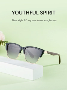 Detail of square sunglasses with wood texture temples and gold metal accents