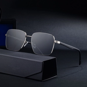 Men's square silver metal polarized sunglasses displayed on a black textured case