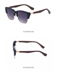 Detail of retro cat-eye sunglasses with wood grain temples and gold metal accents