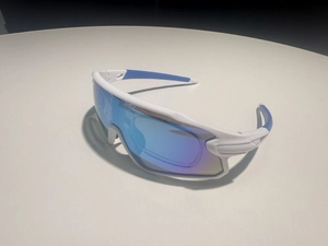 White cycling sunglasses with blue iridescent lens and wrap-around sports frame detail