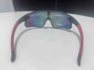 Detail view of sport cycling sunglasses featuring a removable inner RX frame for myopia