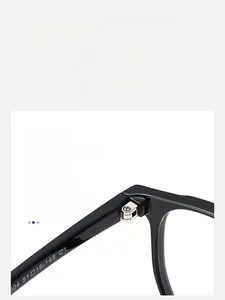 Detail view of durable metal hinge and high-quality black frame of square glasses