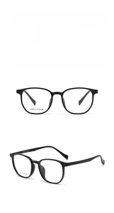 Macro view of square black eyeglass frames with Extreme beauty engraving on the temples