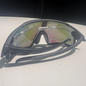 Black sports cycling sunglasses with rainbow lenses and built-in myopia frame