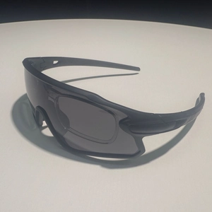 Fashionable sports cycling sunglasses for men featuring a black frame and wrap-around lenses