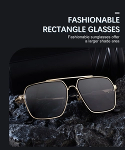 Macro shot of gold metal double bridge design on square frame sunglasses over black rock