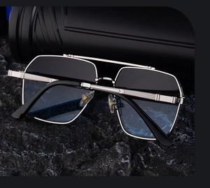 Detailed view of silver metal temples with horizontal stripes and dark gradient lenses