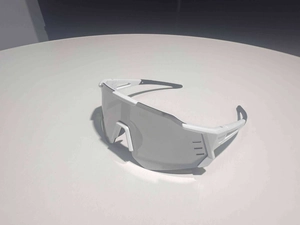 Detail view of white cycling sunglasses with aerodynamic V-shaped nose bridge ventilation