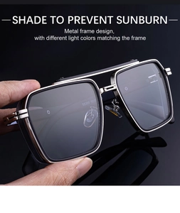 Detail of square metal frame sunglasses with double bridge and engraved inner temple code
