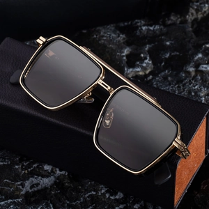 Retro punk square metal sunglasses with gold frame and dark lenses on leather case