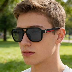 Detail of square polarized sunglasses with double bridge and red stripe on temple