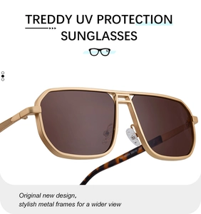 Macro shot of gold metal square sunglasses frame with unique double bridge and UV lenses