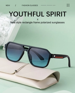 Detail of square polarized sunglasses with red stripe temple and leather case