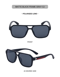 Detail view of matte black polarized sunglasses with a stylish red temple stripe