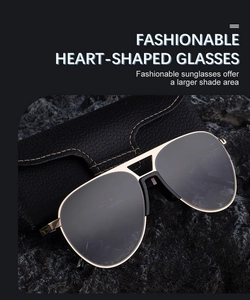 Close-up of classic aviator sunglasses with gold metal frame and black leather case