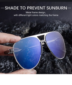 Detail of silver aviator sunglasses with blue lenses and etched frame model number