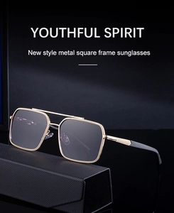 Detail of square gold metal sunglasses with double bridge on a black folding case