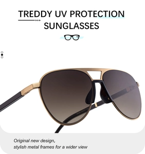 Detail of pilot sunglasses with gold metal frame and brown gradient UV400 lenses