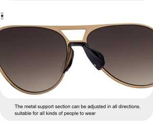 Detail of adjustable nose pads on gold metal aviator sunglasses with brown lenses