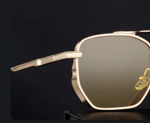 Detail shot of vintage square metal frame and hinge on gold-toned fashion sunglasses