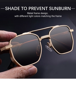 Macro shot of stylish gold metal square sunglasses with dark UV protection lenses