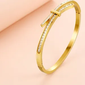Polished titanium steel knot bangle with micro-pave white zircon stones for women