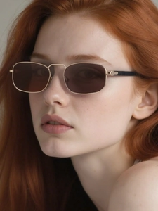 Close-up of golden square metal sunglasses with dark brown lenses on a female model