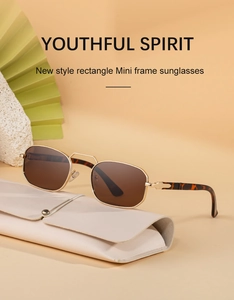 Close-up of retro metal rectangular sunglasses with tortoiseshell temples and leather pouch