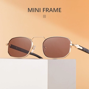Close-up of retro mini octagon sunglasses with gold metal frames and brown lenses
