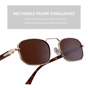 Detail view of gold rectangle metal sunglasses with brown lenses and tortoiseshell tips