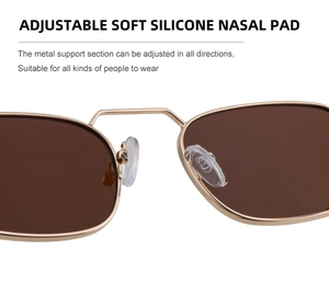 Detailed view of adjustable soft silicone nose pads on gold metal square sunglasses